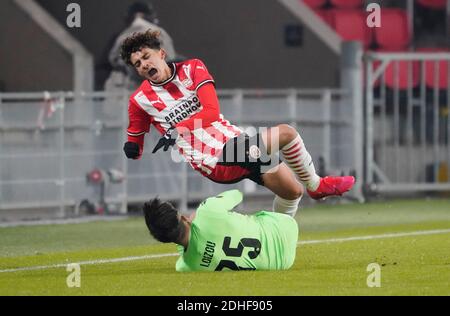 Eindhoven, Netherlands. 10th Dec, 2020. Richard Ledezma (PSV) is injured against Loizos Loizou of Omonoia FC during Uefa Europa League PSV Eindhoven vs Omonoia FC on December 10, 2020 in Eindhoven, Netherlands Photo by SCS/Soenar Chamid/AFLO (HOLLAND OUT) Credit: Aflo Co. Ltd./Alamy Live News Stock Photo