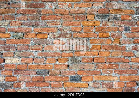Background from an rough old red brick wall Stock Photo