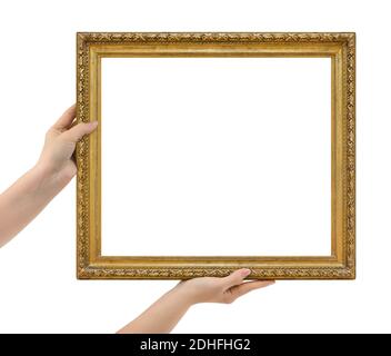 Wooden picture frame in hands Stock Photo