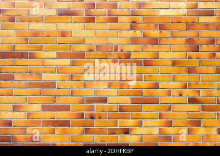 Background from a brownish wall of clinker bricks Stock Photo