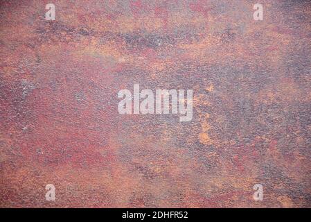 Old metal surface covered with brown rust. Close-up. Stock Photo