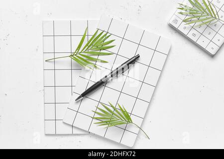 Notebooks with pen on light background Stock Photo