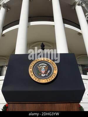 The Presidential Seal is seen on the podium prior to US President Donald Trump speaking about the passage of tax reform legislation on the South Lawn of the White House in Washington, DC, December 20, 2017. Photo by Olivier Douliery/Abaca Press Stock Photo