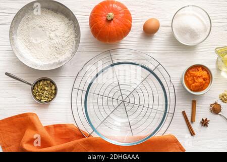 Ingredients for preparing pumpkin pie on table Stock Photo