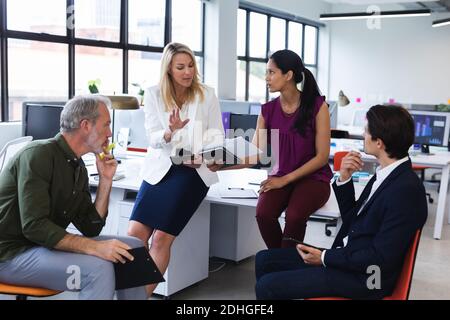 Group of diverse business people brainstorming in modern office Stock Photo