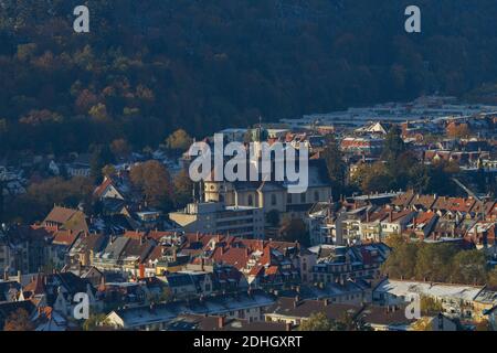 Freiburg im Breisgau, Germany - 11 09 2012: Picturesque view of the city from the mountain, snow-covered Black forest, mountains in the clouds. Stock Photo