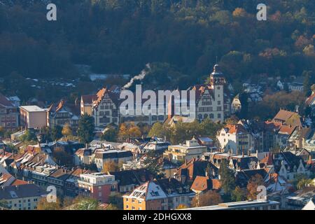 Freiburg im Breisgau, Germany - 11 09 2012: Picturesque view of the city from the mountain, snow-covered Black forest, mountains in the clouds. Stock Photo