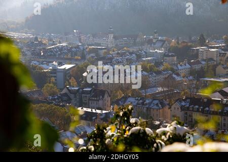 Freiburg im Breisgau, Germany - 11 09 2012: Picturesque view of the city from the mountain, snow-covered Black forest, mountains in the clouds. Stock Photo