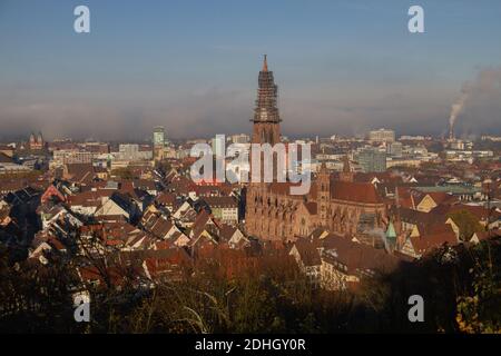 Freiburg im Breisgau, Germany - 11 09 2012: Scenic view to the city and the main church Munster from the mountain, snow-covered Black forest, mountain Stock Photo