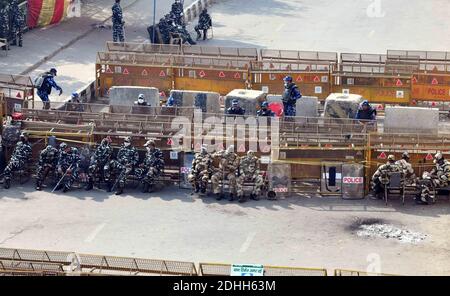 New Delhi, India. 10th Dec, 2020. Police personnel in large numbers sit at the Delhi-Uttar Pradesh border, India, on Dec. 10, 2020. The Indian government is ready for further talks to resolve all issues related to the farming community, Agriculture Minister Narendra Singh Tomar said on Thursday amid the ongoing farmers' protests across the country. Thousands of farmers are camping at inter-state borders around Delhi, protesting against the three new farm laws recently enacted by the federal government. Credit: Partha Sarkar/Xinhua/Alamy Live News Stock Photo