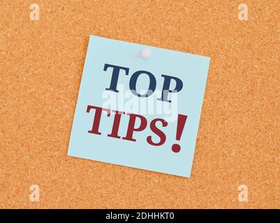 Handwriting text writing Top Tips. Concept meaning small but particularly useful piece of practical advicese Top Tips in blue and red text on an index Stock Photo