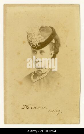 Victorian  CDV (Carte de Visite) of young woman wearing a fashionable hat, called Minnie, dated 1869, by G.L. Collis, Cornhill, E.C. London, U.K.