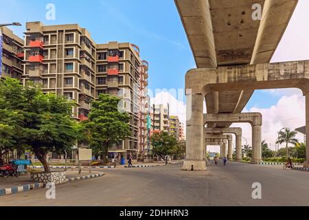 City road with under construction flyover and building apartments at Rajarhat Kolkata India Stock Photo