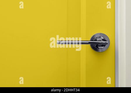 Yellow colored door in modern design apartment Stock Photo