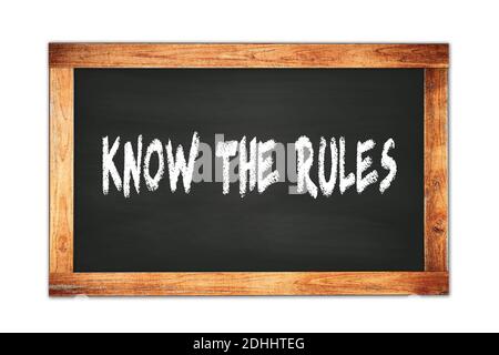 KNOW  THE  RULES text written on black wooden frame school blackboard. Stock Photo