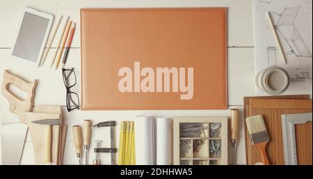Creative designer and carpenter desk with DIY tools and project, top view Stock Photo