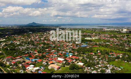 Tacloban city, Leyte island, Philippines. Tropical landscape with panorama of the town, aerial view. Summer and travel vacation concept. Stock Photo
