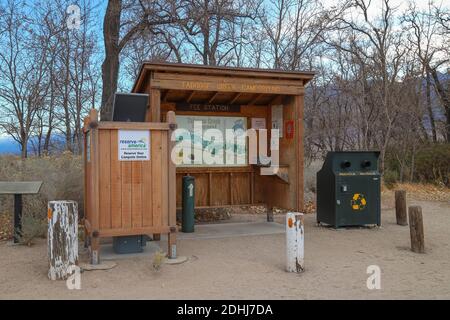 INDEPENDENCE, CALIFORNIA, UNITED STATES - Dec 06, 2020: A self pay station and trash and recycling bins available inside Taboose Creek Campground in t Stock Photo