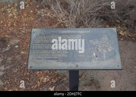 INDEPENDENCE, CALIFORNIA, UNITED STATES - Dec 06, 2020: A metal interpretive sign explains the history of Taboose Creek inside the Taboose Creek Campg Stock Photo