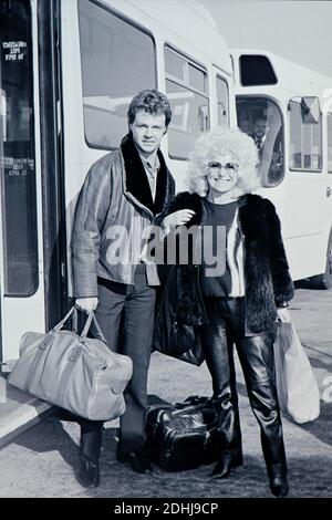 Barbara Windsor and boyfriend Stephen Hollings at London Heathrow Airport, 14th October 1984 Stock Photo