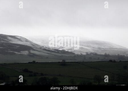 Pictured is a snowy scene in the Yorkshire Dales above Leyburn. weather snow winter snowing Stock Photo