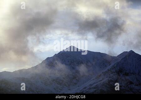 Sunset over the Snowdon horseshoe across showing recent snowfall. Wales. Picture taken 5th December 2020