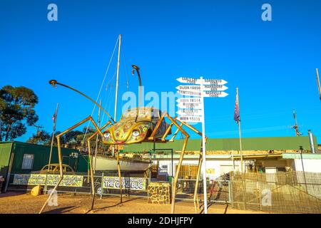 Coober Pedy, South Australia, Australia - Aug 27, 2019: Coober Pedy Opal Bug shop with a beetle car sculpture. Opal mining capital of Australia and Stock Photo