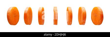 Carrot slices levitating in the air isolated on white background Stock Photo