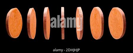 Sweet potato slices levitating in the air on black background Stock Photo