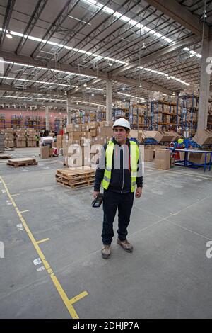 Portrait of male warehouse worker standing with barcode scanner in Warehouse /Samsonite  Latin American (LATA ) distribution center in Chile Stock Photo