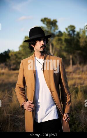 Man bearded hipster stylish fashionable coat and hat. Comfortable outfit.  Achieve desired fit. Hipster outfit and hat accessory. Stylish casual outfit  spring season. Menswear and male fashion concept Stock Photo