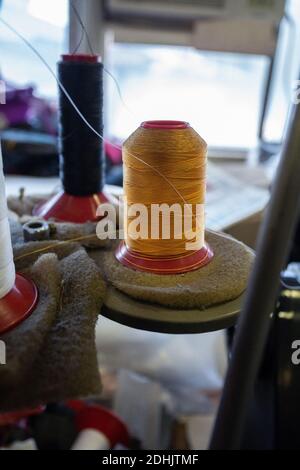 Colorful Sewing thread line spools, big and small, scissors, frill soft ...