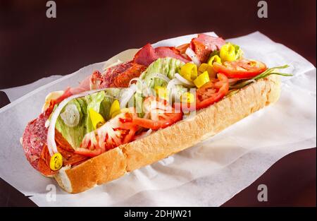 Spicy Italian Sub Sandwich on Parchment Paper Stock Photo