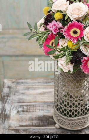 Red and pink bouquet with roses, gerberas, carnations and freesias. Party decor Stock Photo