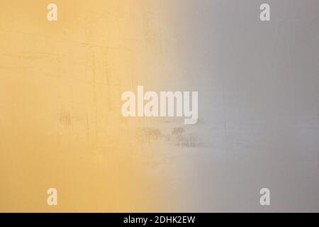 Shabby plaster texture with a gradient of yellow and gray. Background for text, template. Stock Photo
