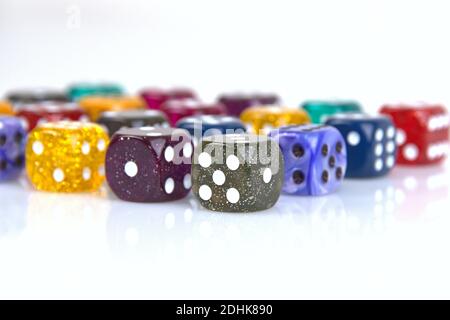 Deutschland. 08th Dec, 2020. The die is cast". Colorful dice in a row with a slight reflection on the ground in front of a neutral background. | usage worldwide Credit: dpa/Ģ����ý Live News Stock Photo