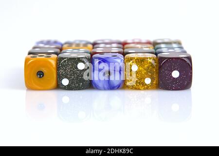 Deutschland. 08th Dec, 2020. The die is cast". Colorful dice in a row with a slight reflection on the ground in front of a neutral background. | usage worldwide Credit: dpa/Ģ����ý Live News Stock Photo