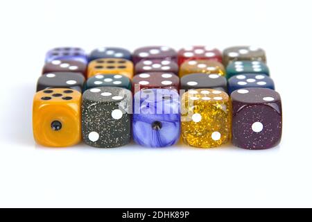 Deutschland. 08th Dec, 2020. The die is cast". Colorful dice in a row with a slight reflection on the ground in front of a neutral background. | usage worldwide Credit: dpa/Ģ����ý Live News Stock Photo