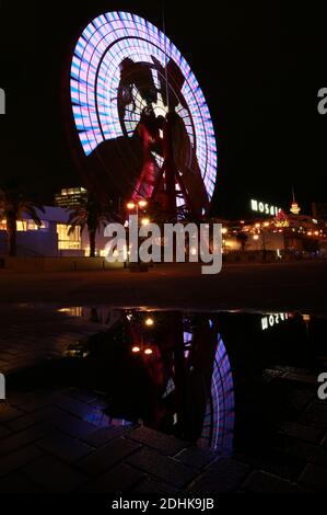 ferris wheel change color at night in japan at kobe Stock Photo