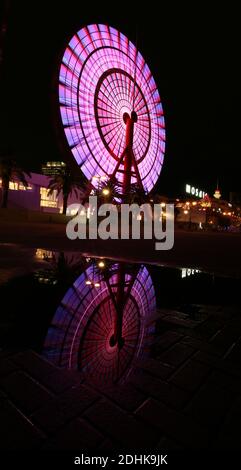 ferris wheel change color at night in japan at kobe Stock Photo