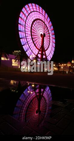 ferris wheel change color at night in japan at kobe Stock Photo