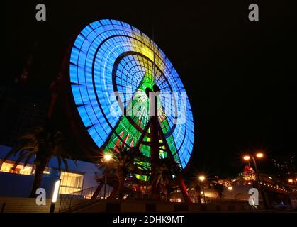 ferris wheel change color at night in japan at kobe Stock Photo