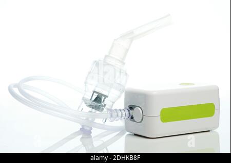 Portable nebulizer device with tube isolated on white studio background front view Stock Photo