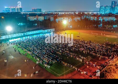 Chengdu. 11th Dec, 2020. Aerial photo taken on Dec. 11, 2020 shows students waiting in lines for nucleic acid tests at the Xihua University in Pidu District of Chengdu, southwest China's Sichuan Province. Southwest China's Chengdu launched a nucleic acid testing drive Friday, offering free tests to all residents in the city's Pidu District, where several new COVID-19 cases have emerged since earlier this week. The district's COVID-19 prevention and control headquarters said the drive started at 6 p.m., with testing expenses covered by the district government. Credit: Xinhua/Alamy Live News Stock Photo