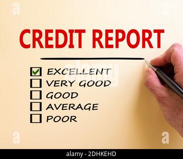Excellent credit report symbol. Male hand with pen. Words 'credit report' and other business terms on white paper. Business and excellent credit repor Stock Photo