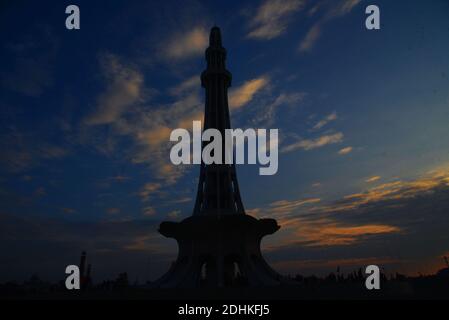 Lahore, Pakistan. 11th Dec, 2020. Pakistani people visit the greater Iqbal Park after weather turnout pleasant during an attractive stunning beautiful mesmerizing view of the colorful clouds hovering on sky at greater Iqbal Park historical Minar-e-Pakistan Lahore. (Photo by Rana Sajid Hussain/Pacific Press) Credit: Pacific Press Media Production Corp./Alamy Live News Stock Photo