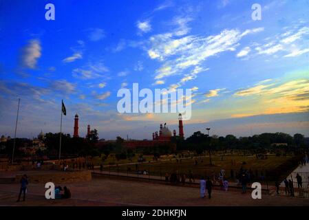 Lahore, Pakistan. 11th Dec, 2020. Pakistani people visit the greater Iqbal Park after weather turnout pleasant during an attractive stunning beautiful mesmerizing view of the colorful clouds hovering on sky at greater Iqbal Park historical Minar-e-Pakistan Lahore. (Photo by Rana Sajid Hussain/Pacific Press) Credit: Pacific Press Media Production Corp./Alamy Live News Stock Photo