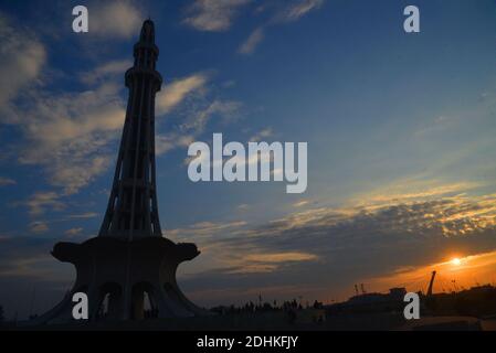 Lahore, Pakistan. 11th Dec, 2020. Pakistani people visit the greater Iqbal Park after weather turnout pleasant during an attractive stunning beautiful mesmerizing view of the colorful clouds hovering on sky at greater Iqbal Park historical Minar-e-Pakistan Lahore. (Photo by Rana Sajid Hussain/Pacific Press) Credit: Pacific Press Media Production Corp./Alamy Live News Stock Photo