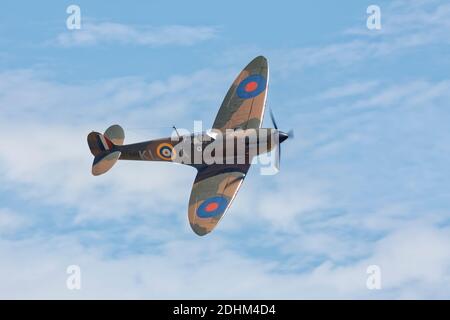 Supermarine Spitfire flypast showing top side. Stock Photo