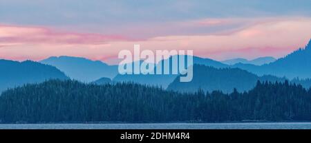 Hazy mountains along the coast of Alaska's Inside Passage. Stock Photo
